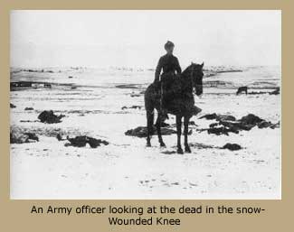 An Army officer looking at the dead in the snow - Wounded Knee